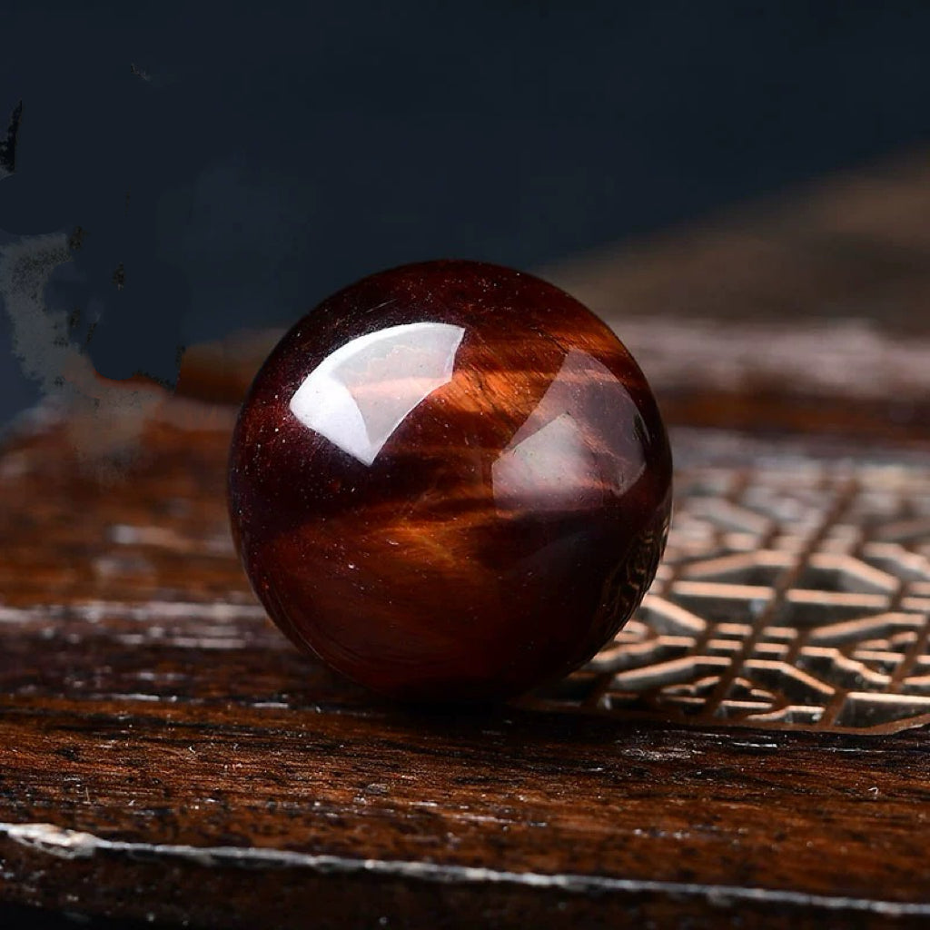 Red tiger eye stone sphere