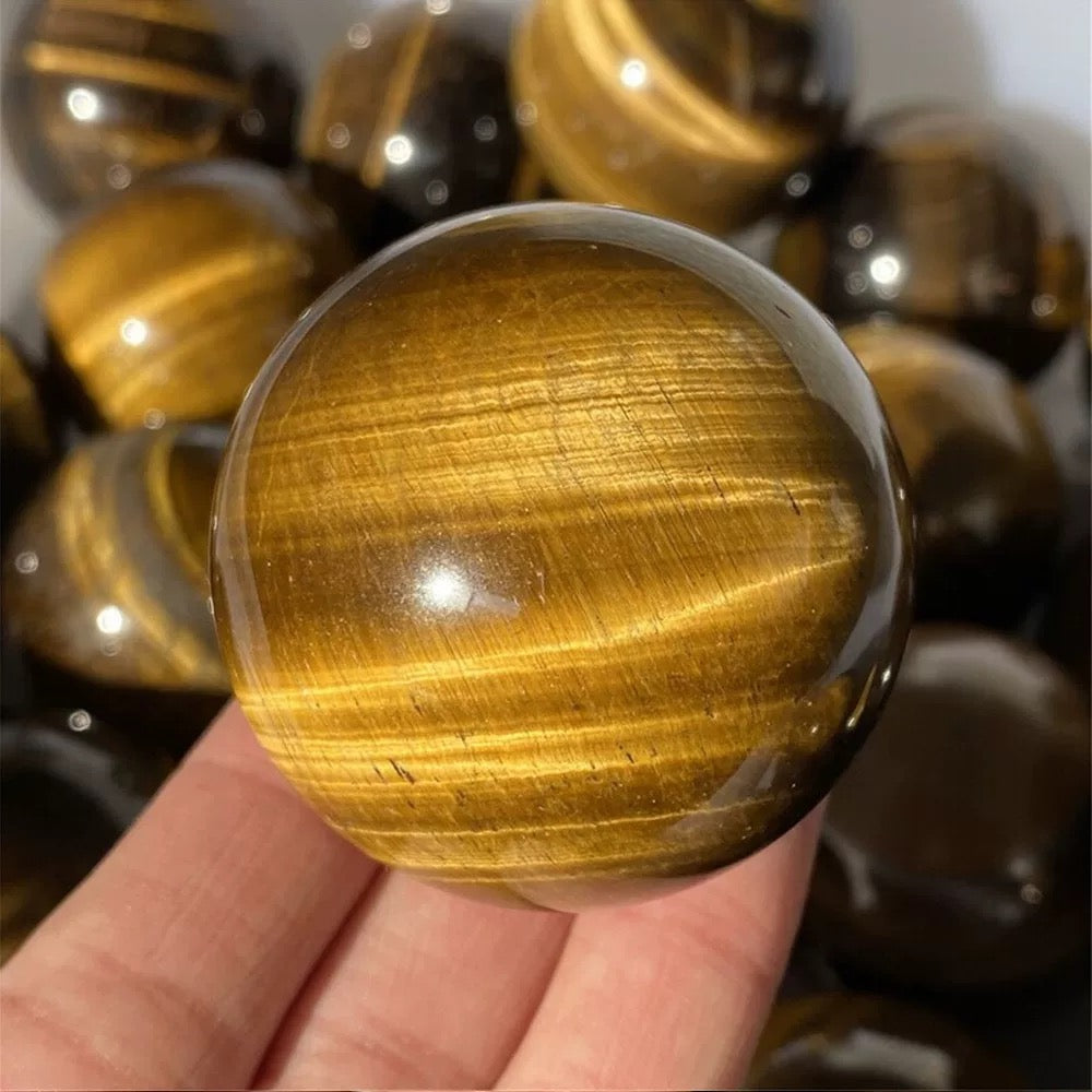 Yellow tiger eye stone sphere