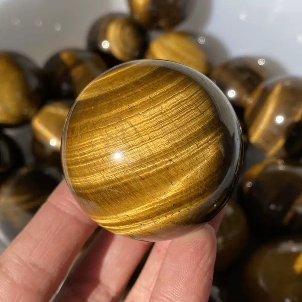 Yellow tiger eye stone sphere