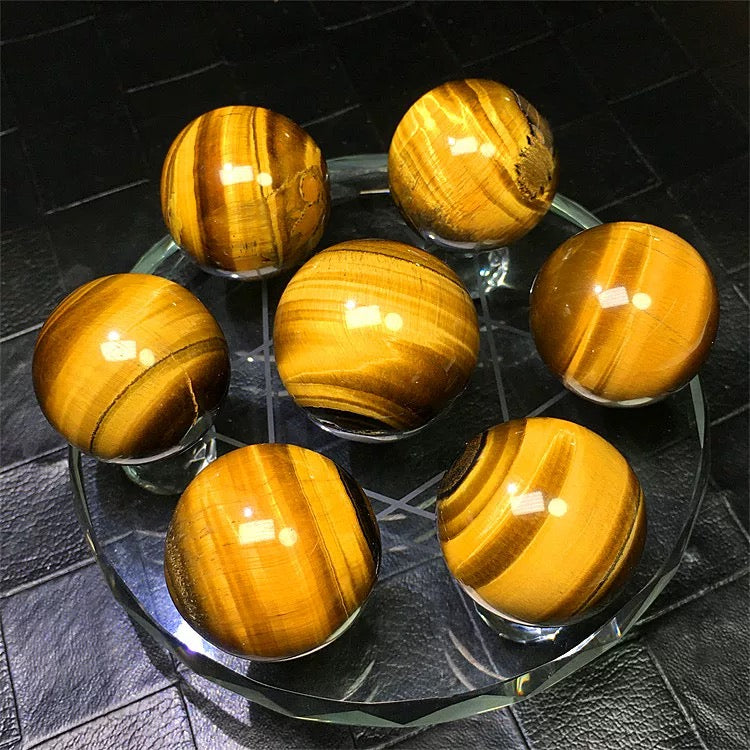 Yellow tiger eye stone sphere