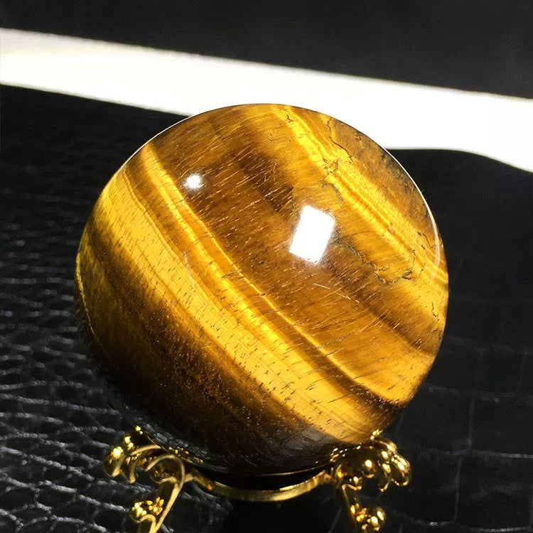 Yellow tiger eye stone sphere
