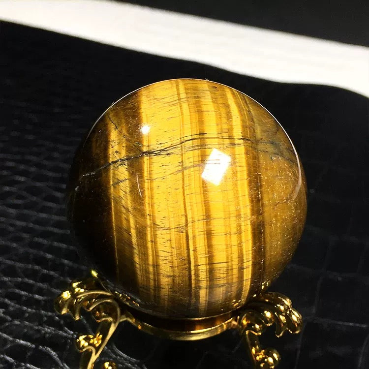 Yellow tiger eye stone sphere