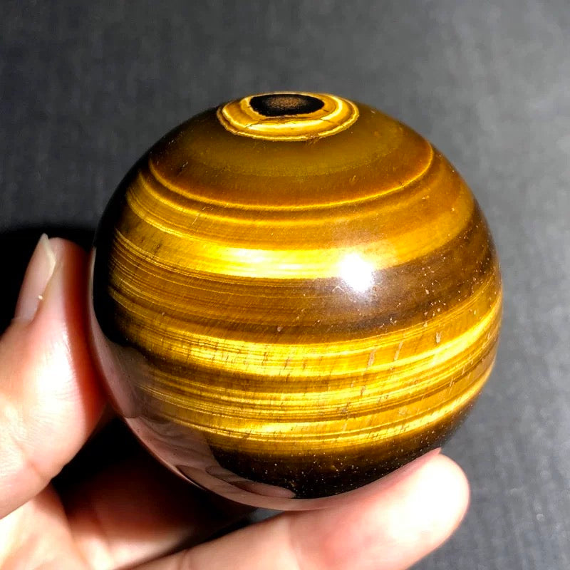 Yellow tiger eye stone sphere