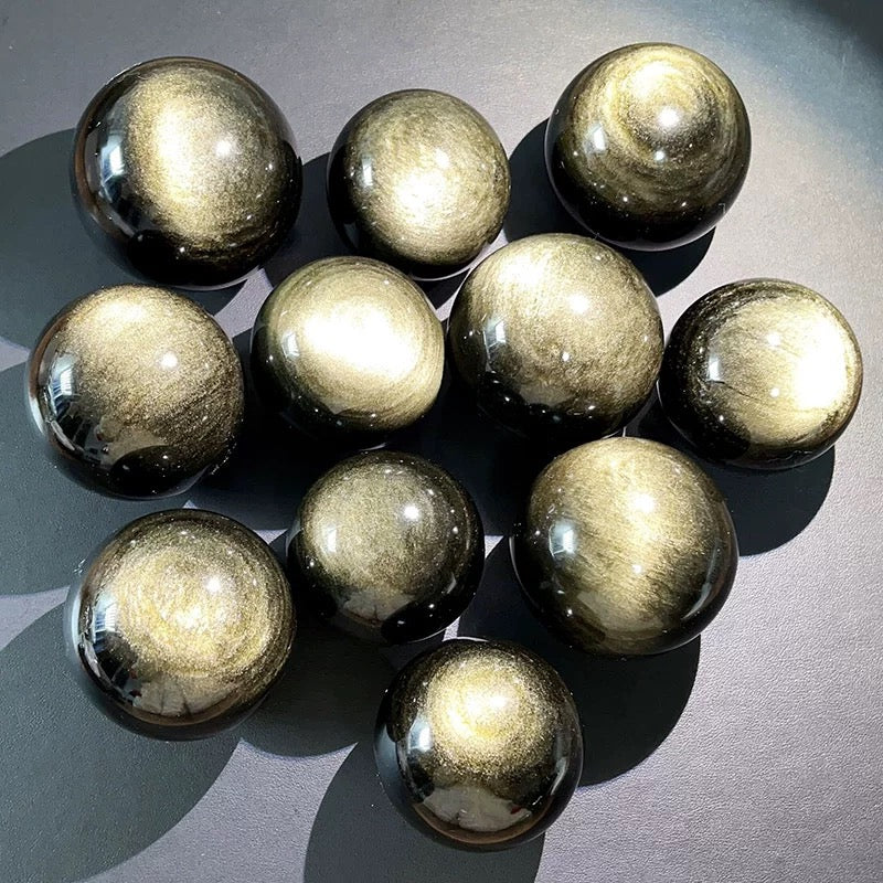 Golden-color obsidian sphere